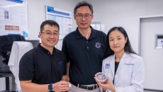 Representatives from NTU Singapore, Procter & Gamble, and Agency for Science, Technology and Research pose side-by-side while showing the HapSense ring-type device for skincare cosmetic product analysis.