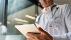 Person looking down at tablet