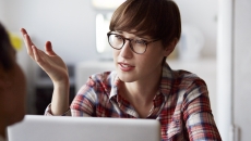 
  Person at a computer talking
