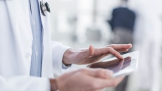 
  Healthcare provider on a tablet
