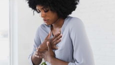 
  Person holding their chest
