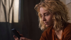 
  Person looking at a phone
