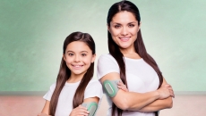 
  An adult and child wearing the Nerivio device.
