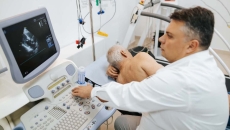 
  A doctor conducting a cardiac ultrasound.
