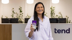 
  Olympian Valeria Adams showing the Tend Health app 
