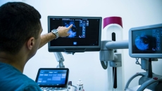 
  A doctor looking at a mammogram. 
