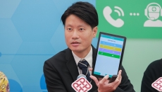 
  PolyU Assistant Professor Dr Ankers Wong presenting their mobile health management app for the elderly 

