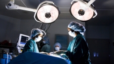 
  Surgeons during an operation.
