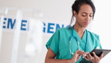 Healthcare provider holding a tablet