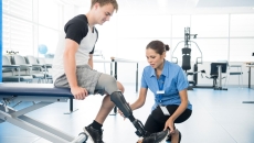Amputee with a physical therapist