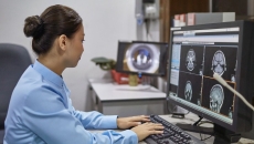A radiologist examining an X-ray report