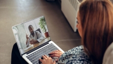 Person talking with provider on laptop