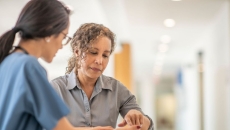 
  A person talking to her doctor.
