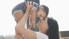 
  A person holding a baby
