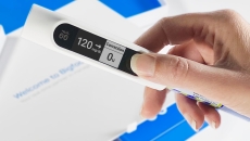 Hand holding Bigfoot rapid-acting smart insulin pen