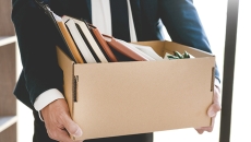 Businessperson carrying a box