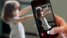 Caregiver records child on smartphone using Cognoa's Canvas Dx diagnostic software