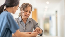 Doctor talks to patient