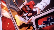 EMTs loading a patient into an ambulance