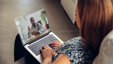 Patient consulting with a health coach on their laptop