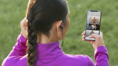 Peloton user checks the app before going on a run