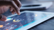 A close up of an iPad showing data analysis