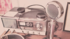 An old-timey microphone and radio setup represent our weekly digital health podcast