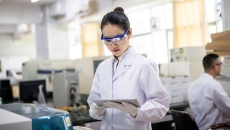 Researcher looking at a tablet