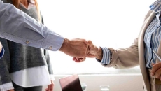 Man and woman shaking hands in the office