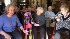 Senior residents at Allity interacting with the companion robot Abi by Andromeda Robotics