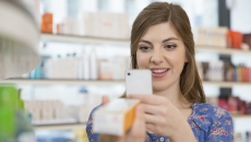 Person taking a picture of a medication box