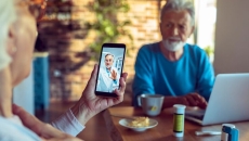 Patient interacting with healthcare professional via smart phone