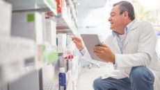 Pharmacist reviewing inventory