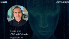 Munjal Shah, Hippocratic AI CEO_Artificial intelligence robot and binary by Yuichiro Chino/Moment/Getty Images