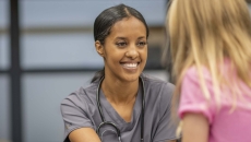 Person sitting with a school nurse