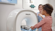 A child using the Kitten Scanner