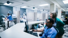 Medical professionals using computer in hospital