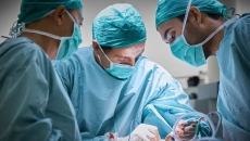 Surgeons in an operating room performing a procedure