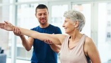 A physiotherapist working with a senior patient