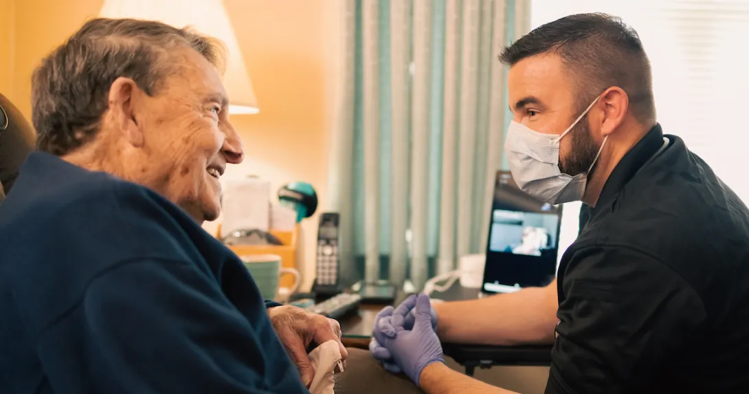 An Atrium Health community paramedic consults with patient in his home.
An Atrium Health community paramedic consults with patient in his home.
