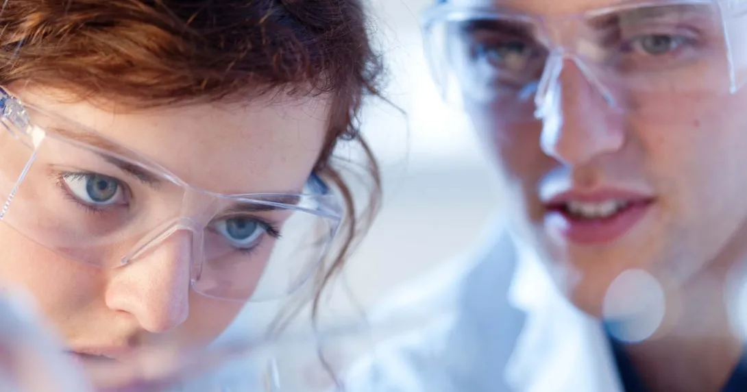 Two healthcare professionals wearing safety goggles Two healthcare professionals wearing safety goggles