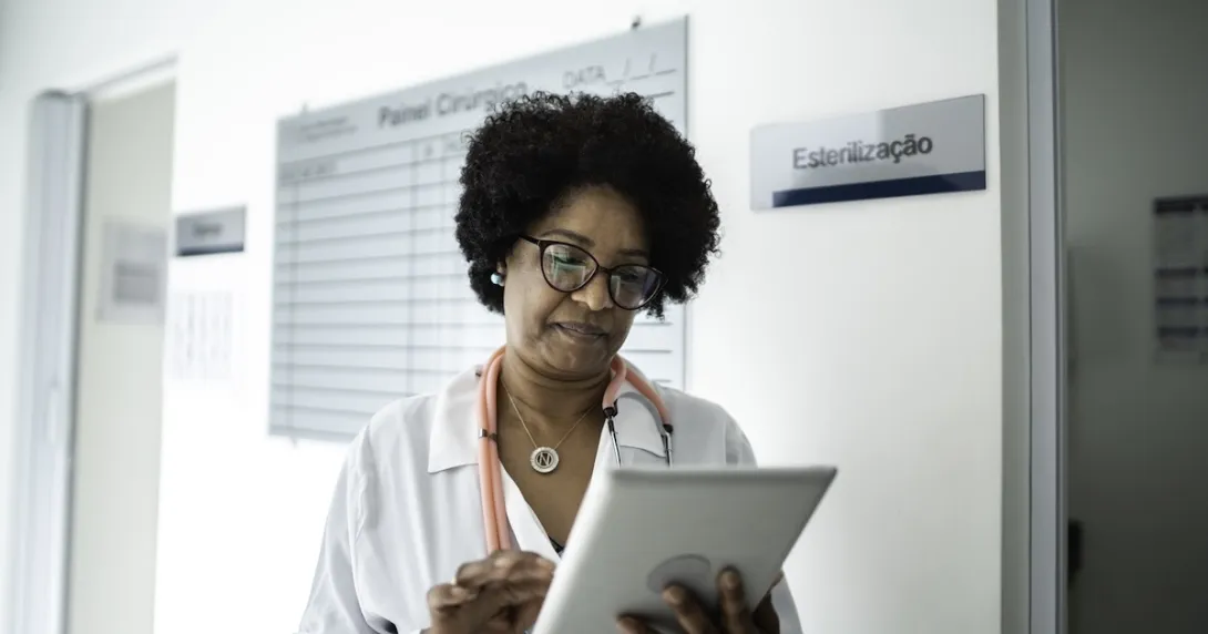 Clinician reviewing patient information Clinician reviewing patient information