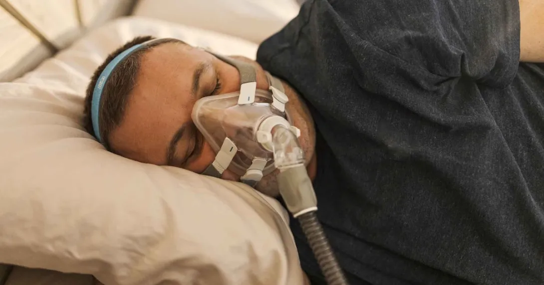 Man with CPAP mask Man with CPAP mask