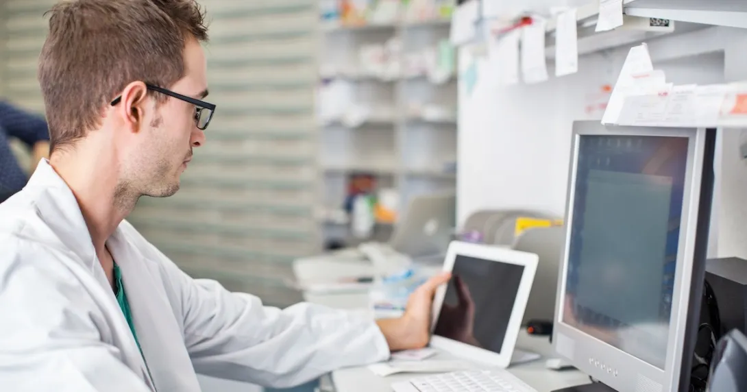 Healthcare professional looking at data on a screen Healthcare professional looking at data on a screen