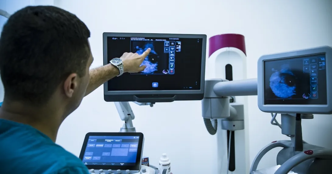 Healthcare professional reviewing imaging results Healthcare professional reviewing imaging results