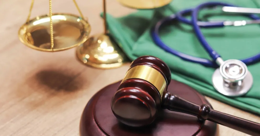 A gavel and a stethoscope.
A gavel and a stethoscope.