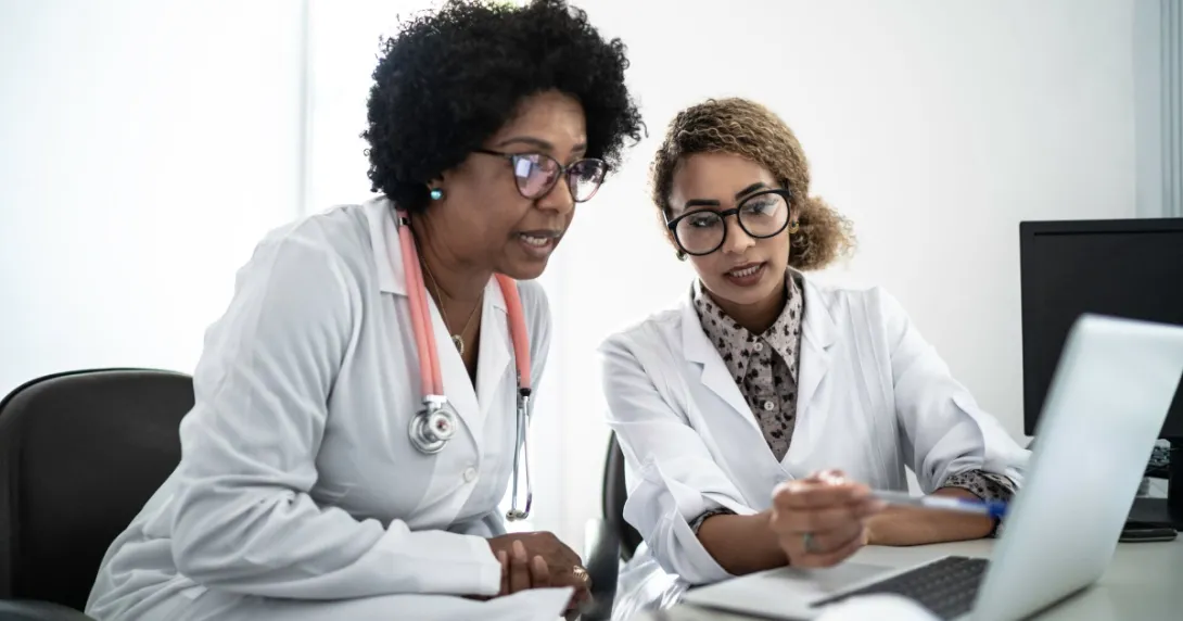 Two healthcare providers on a computer
Two healthcare providers on a computer