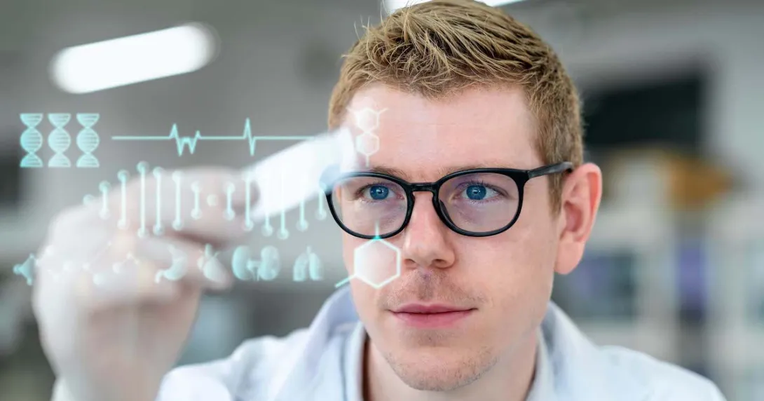 Scientist in a laboratory holding a microscope slide with digitization display in a laboratory Scientist in a laboratory holding a microscope slide with digitization display in a laboratory