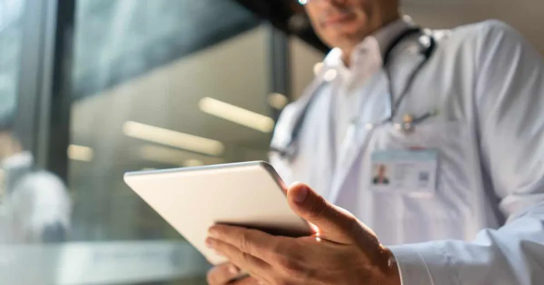 Doctor looking at tablet Doctor looking at tablet