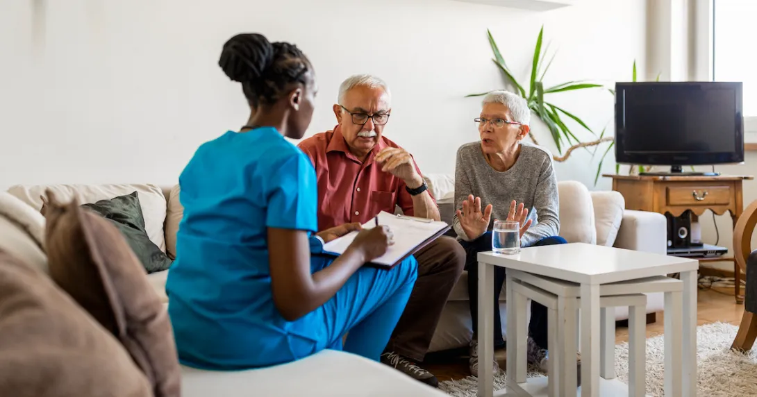 Two people sitting on a couch talking to a healthcare provider who is sitting on a different couch
Two people sitting on a couch talking to a healthcare provider who is sitting on a different couch